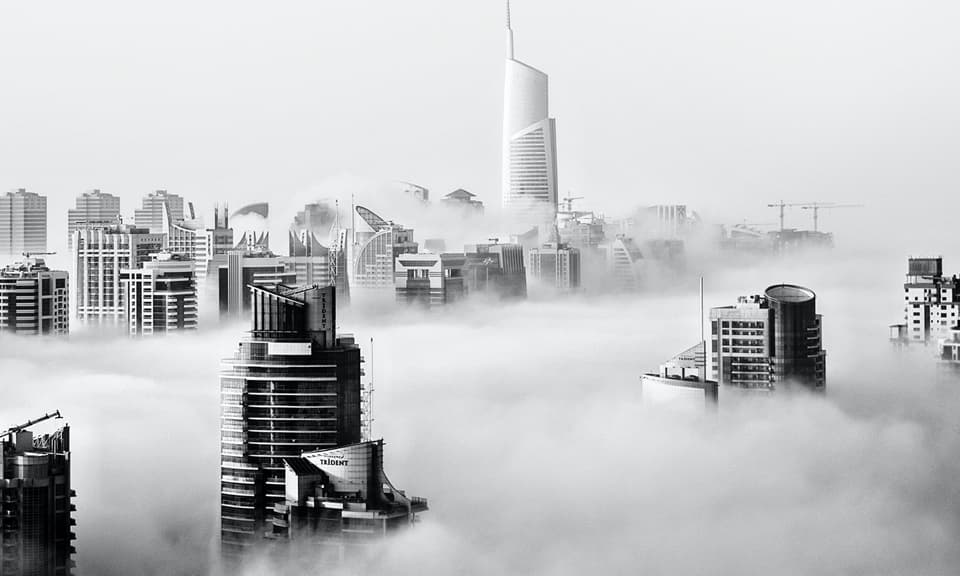 Skyscrypers above clouds.